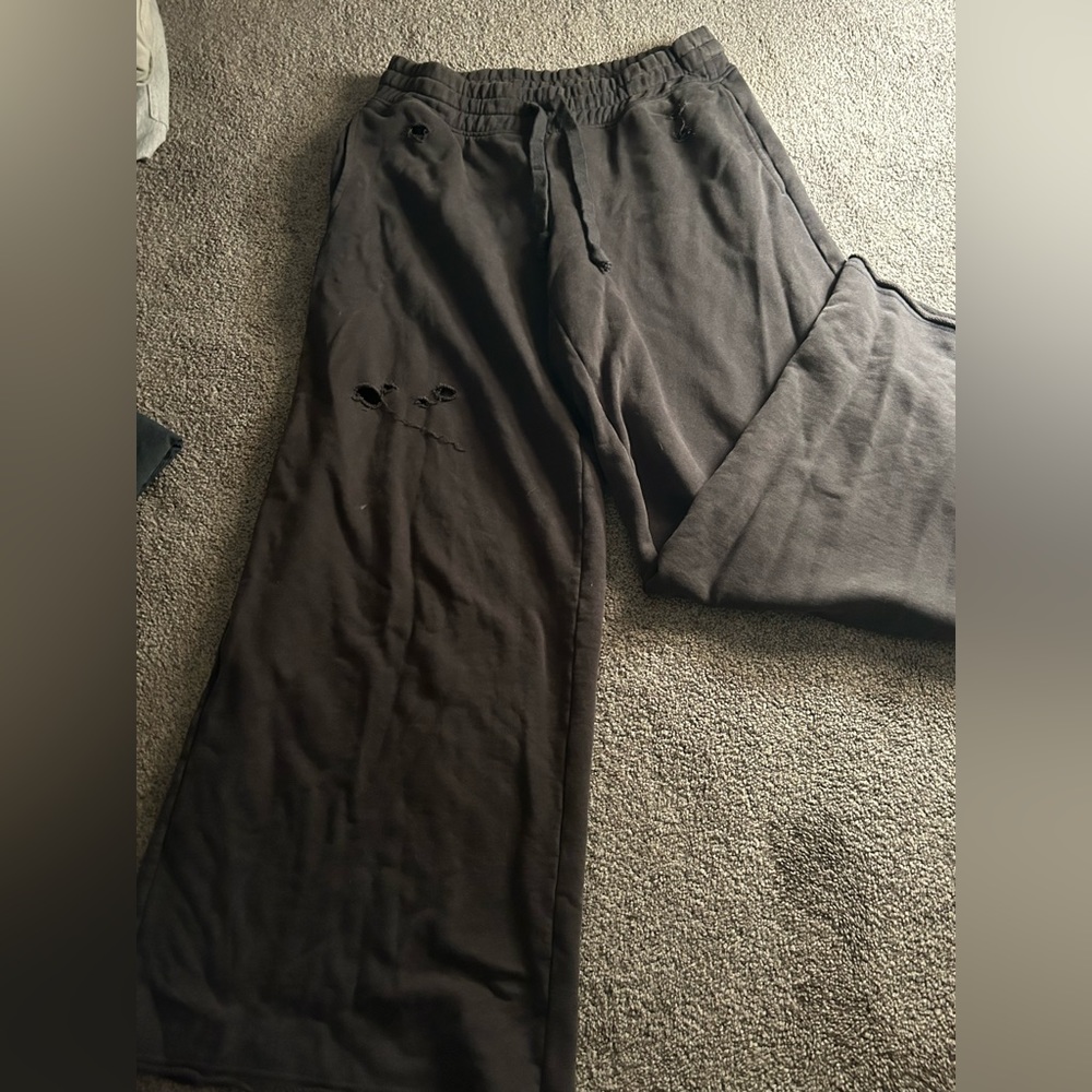 Dark grey, Arie extremely baggy ripped sweatpants.